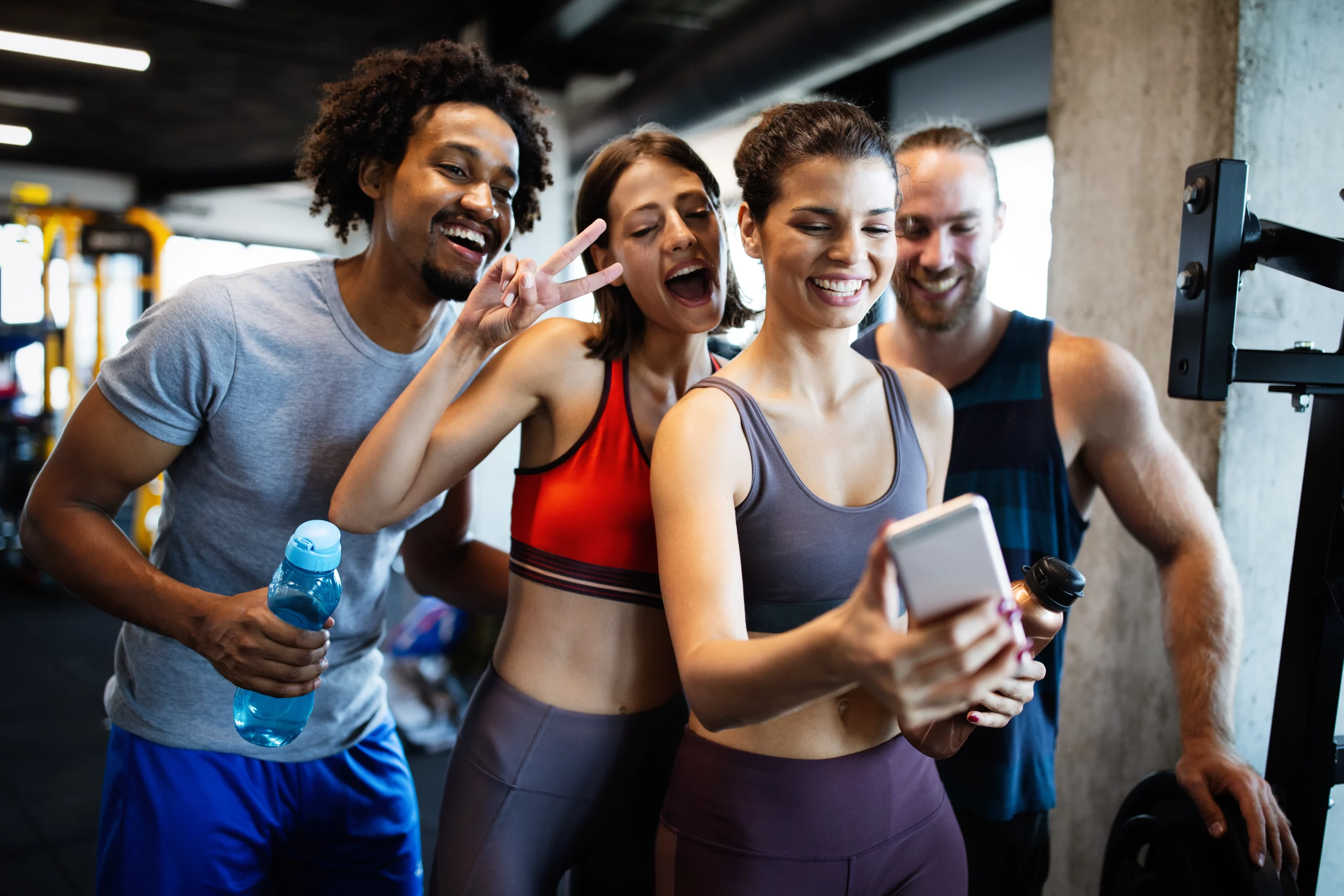 gym members taking selfies; direct debit for gyms | Biz Core